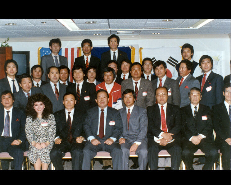 Tae Yun Kim, the only woman in this photograph of Great Grandmasters.
